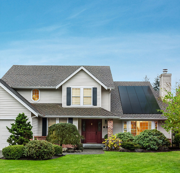 House with solar panels and blue sky